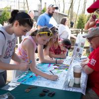 Zoo guests at Earth Day celebration table